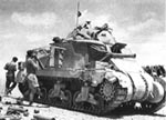 British M3 in action, Libyan desert, 1942